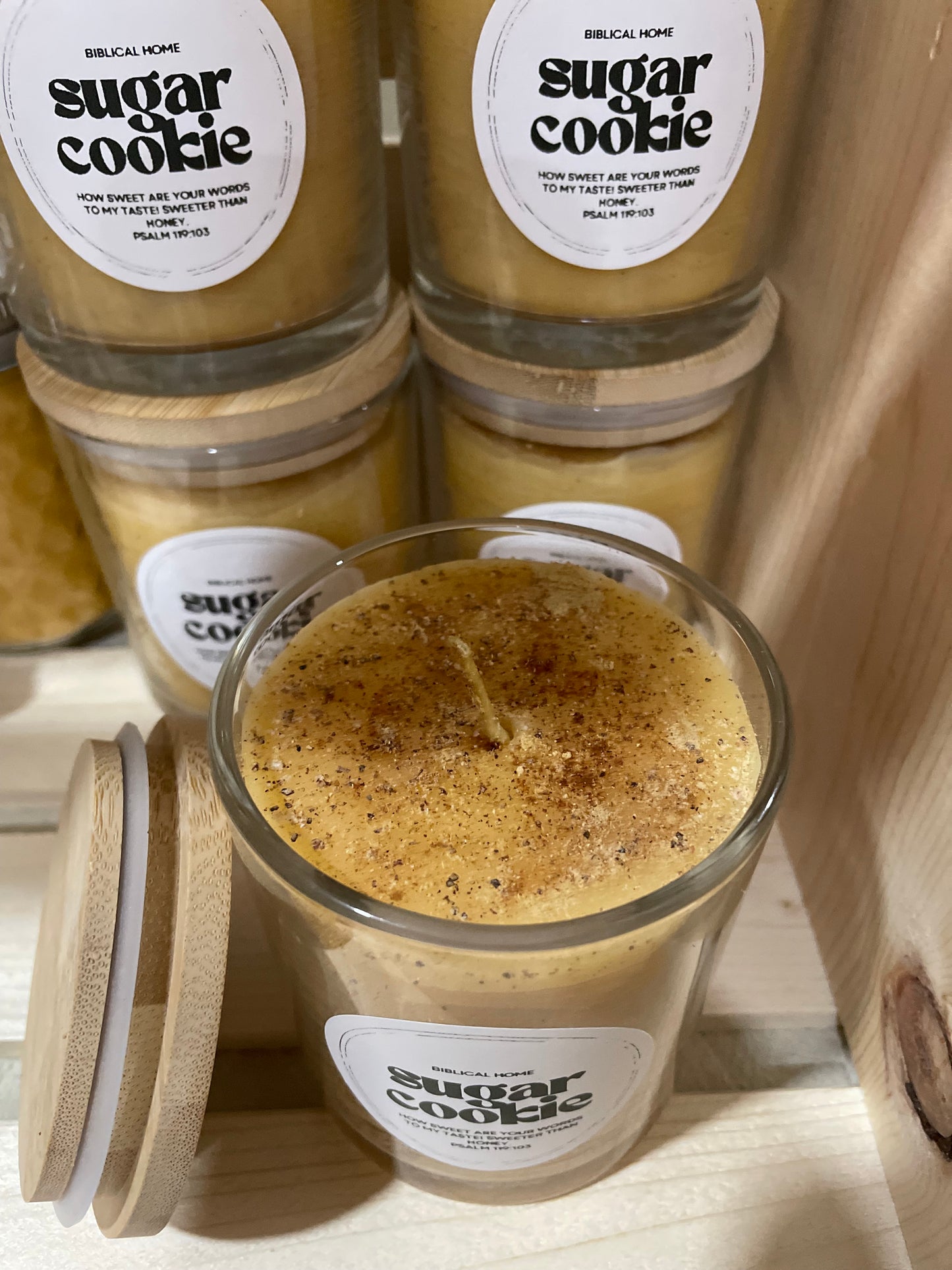 Hand-poured beeswax candle in a reusable jar with a cozy, seasonal scent of sugar cookie, perfect for creating a relaxing, eco-friendly atmosphere