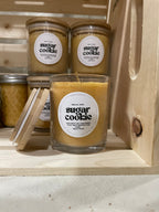 Hand-poured beeswax candle in a reusable jar with a cozy, seasonal scent of sugar cookie, perfect for creating a relaxing, eco-friendly atmosphere