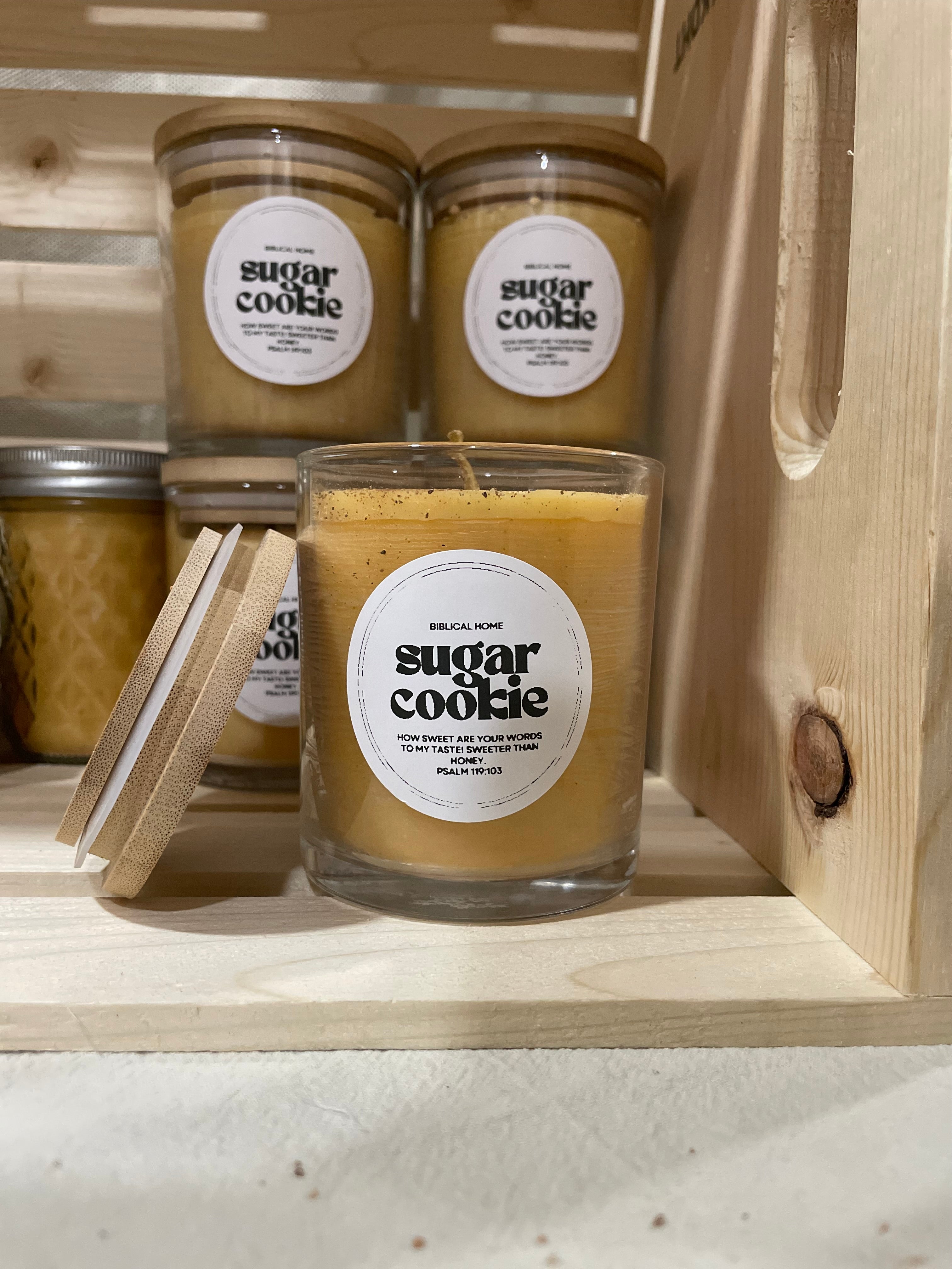 Hand-poured beeswax candle in a reusable jar with a cozy, seasonal scent of sugar cookie, perfect for creating a relaxing, eco-friendly atmosphere